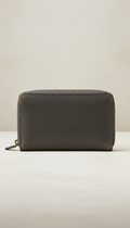 Graphite zip-around wallet, perfectly centered horizontally and vertically with equal negative space above and below,...