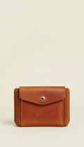 Accordion wallet in burnished cognac leather, Default angle: elevated 3/4 front with bag facing camera to showcase...